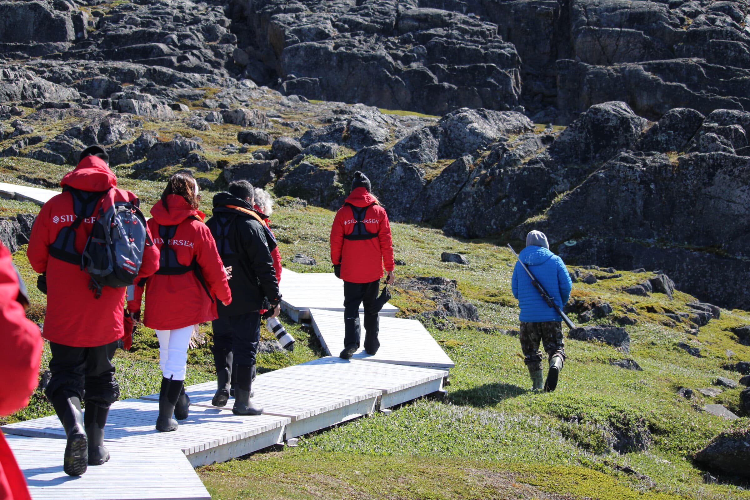 Passengers from the cruise ship Silver Endeavour tour Mallik Island in Kinngait, in summer 2024. Tourism operators discussed how to increase tourism benefits for Inuit during the 2025 Travel Nunavut conference and annual general meeting in Iqaluit. (File photo by Arty Sarkisian)